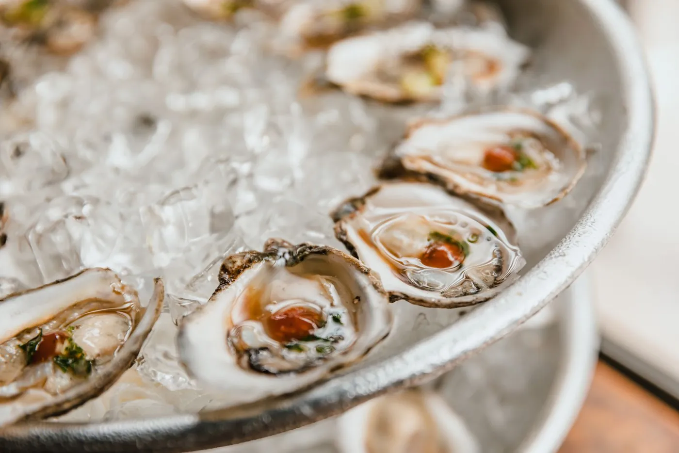 Freshly shucked Merimbula oysters served on ice with lemon